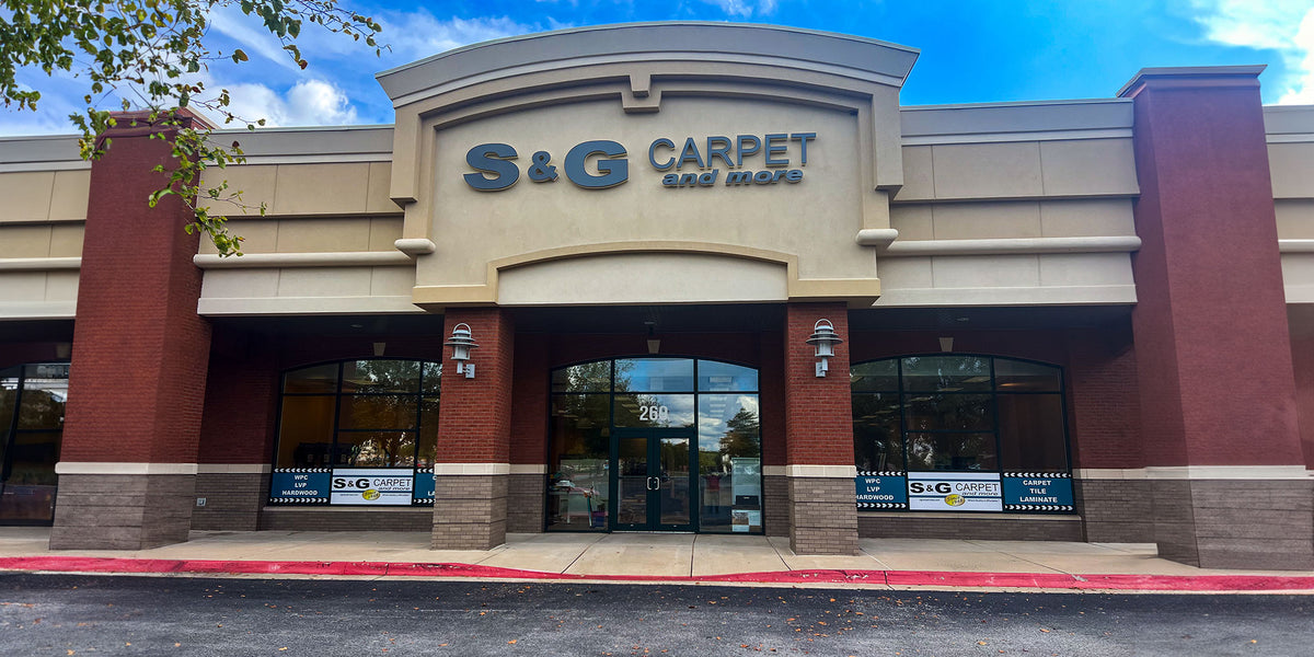 Brick and stucco storefront of the S&G Carpet and More showroom in Rogers, Arkansas