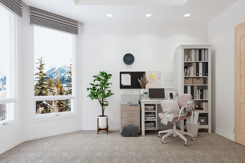 Beige textured carpet in a home office with a white desk, bookshelf, and mountain view window