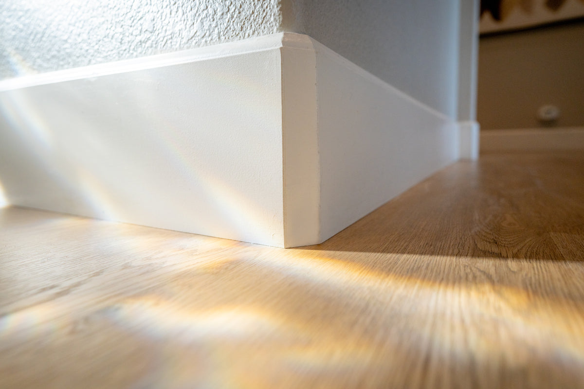 A bright interior featuring warm light wood flooring.