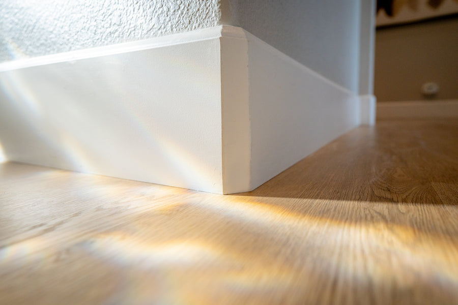A bright interior featuring warm light wood flooring.