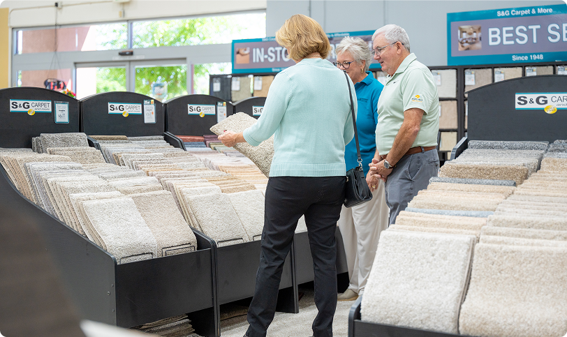 Customers browse carpet samples in bins at the S&G Carpet and More showroom.