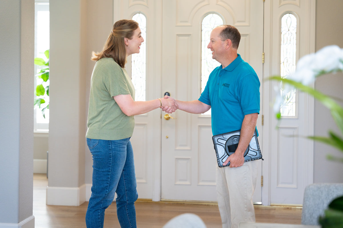 An S&G team member consults with a customer about flooring.